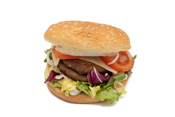 A double meat burger, with the ingredients, lettuce, cabbage, cucumber, tomato, onion, cheese, ketchup, mayonnaise. Isolated on white background. One of the most consumed snacks in the world.