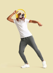 Dancing man with head of dog and headphones on light background