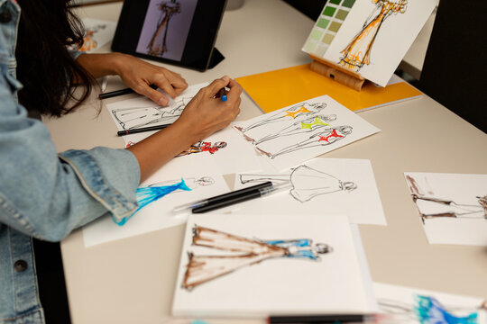 Fashion designer drawing on desk