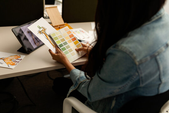 Designer selecting colors on palette