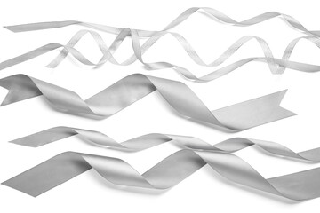Curly silver ribbons on white background