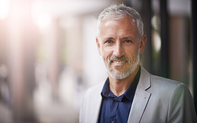 Im confident in my abilities. Portrait of a mature businessman standing outside.