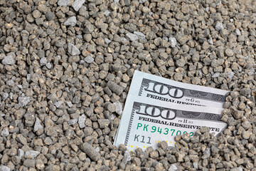 Closeup of agriculture fertilizer with cash money. Farm fertilizer supply, shortage and price...