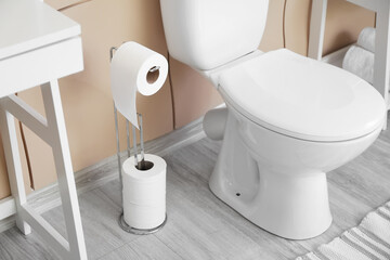 Interior of modern restroom with toilet bowl