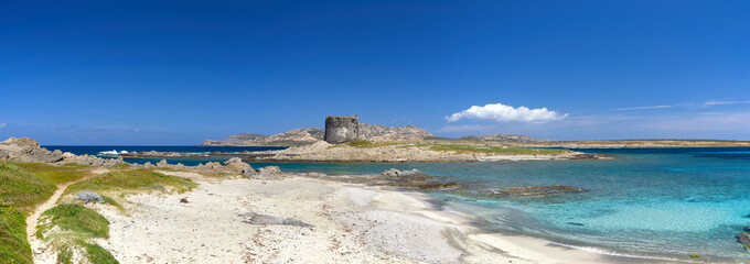 Beautiful panoramic view of Pelosa Beach (Spiaggia Della Pelosa). Stintino. La Pelosa beach, probably the most beautiful beach in Sardinia, Italy. Popular travel destination. Mediterranean seacoast.