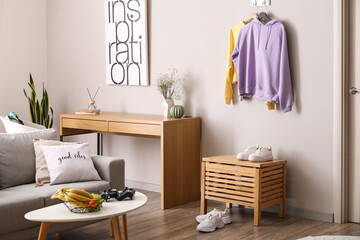Interior of room with hoodies hanging on wall