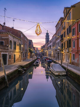 Sunset at a small canal in Venice, Italy