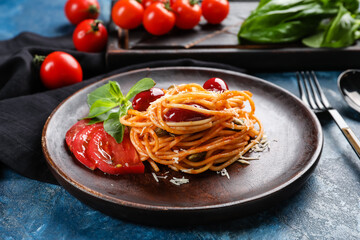 Plate with delicious Pasta Puttanesca on color background