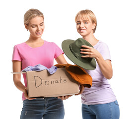 Young women holding box with donations on white background