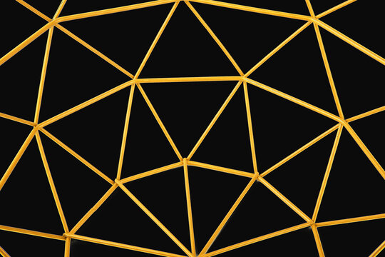 closeup of golden trangle shaped isolated on black  background