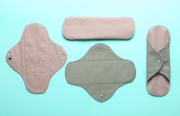 Reusable menstrual pads on blue background