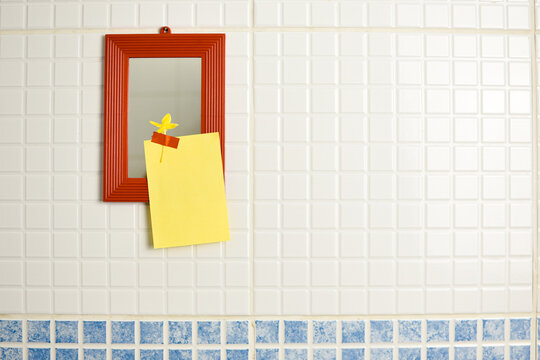 Yellow Note Reminder Paper Sticked In Orange Mirror With A Glitter Orange Sticker In The Bathroom. Self Love Message.