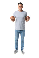 Naklejka premium Handsome young man in stylish t-shirt isolated on white