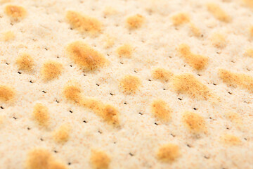 Traditional Jewish flatbread matza for Passover as background, closeup