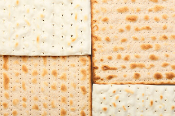 Traditional Jewish flatbread matza for Passover as background, closeup