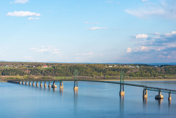 The bridge (le pont de l'ile) above the St Lawrence river between the Quebec city and the Orleans...