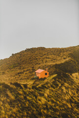 Alpine hut in mountain scenery in New Zealand