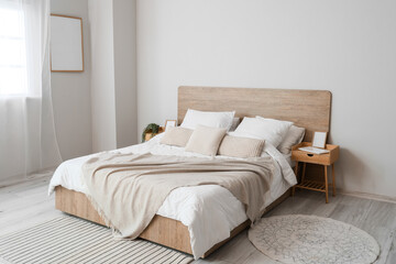 Comfortable bed and nightstands in room - obrazy, fototapety, plakaty