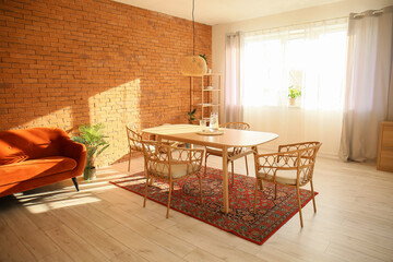 Interior of modern dining room with table and vintage carpet