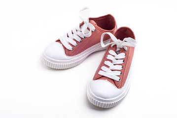 Children's pink sneakers, with white soles and laces