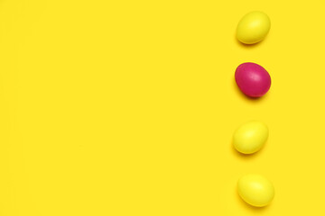 Colorful Easter eggs on yellow background