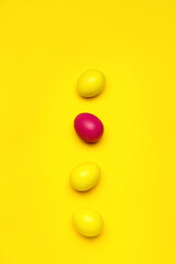 Colorful Easter eggs on yellow background