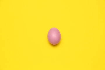 Beautiful Easter egg on yellow background