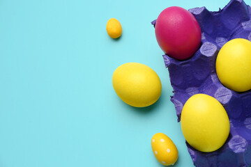 Holder with painted Easter eggs on color background, closeup