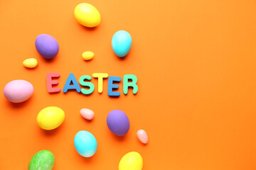 Composition with painted eggs and word Easter on color background