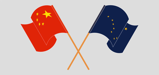 Crossed and waving flags of China and the State of Alaska