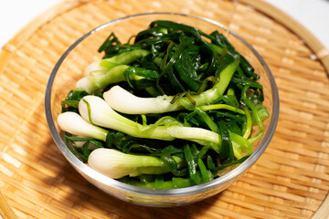 Pickled spring onion in glass bowl