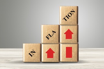 Wooden Cubes, dice or blocks with inflation on wooden background