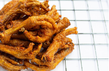 Fried chicken feet on white background.