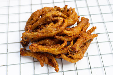 Fried chicken feet on white background.
