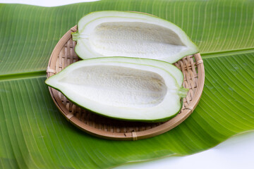 Green papaya on banana leaf
