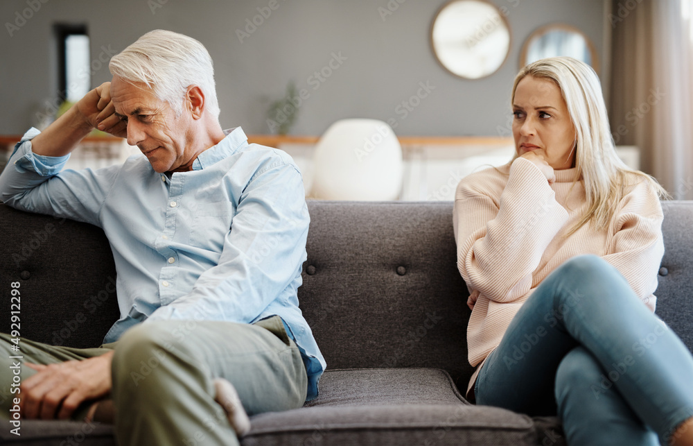 Poster i want to talk but i dont know how. shot of a mature couple having a disagreement at home.