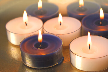  Candle flame.White and blue burning candles .Candles background. .Magic and esoteric.
