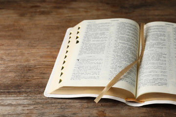Open Bible on wooden table. Christian religious book