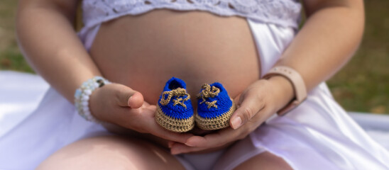 
pregnant with baby shoes