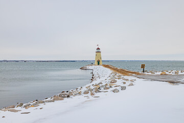 Overcast view of the snowy Lake Hefner lighthouse