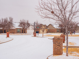 Overcast view of snowy residence house
