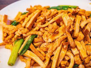 Close up shot of pork slice fried with tofu