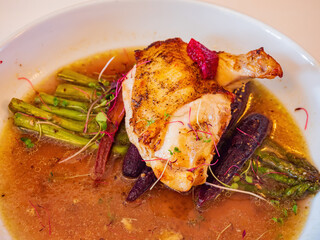 Close up shot of asparagus with grill chicken leg