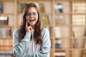 Obraz premium Thoughtful schoolgirl, preteen kid thinking looking at copy space having question, making choice.