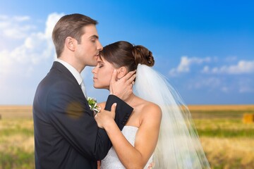 Happy wedding couple in natural background