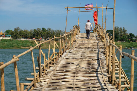 Kampong Cham, Cambodia - February 2022: The Kampong Cham bamboo bridge in Cambodia is the longest in the world on February 6, 2022 in Kampong Cham, Cambodia.