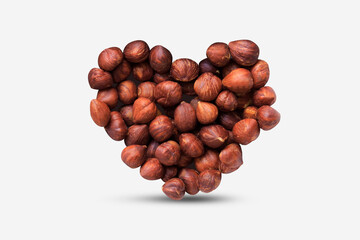 Hazelnut  pieces heart shape on white