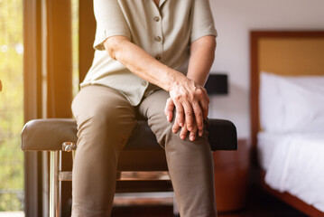 Middle aged adult woman suffering from arthritis disease,Women touching on knee,Osteoarthritis - obrazy, fototapety, plakaty