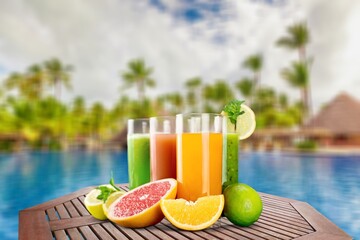 Swimming pool with drinks on tropical island, cocktails and canapÃ©s for romantic date or honeymoon in luxury hotel,