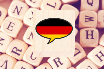 Buchstaben, deutsche Sprache und Flagge von Deutschland